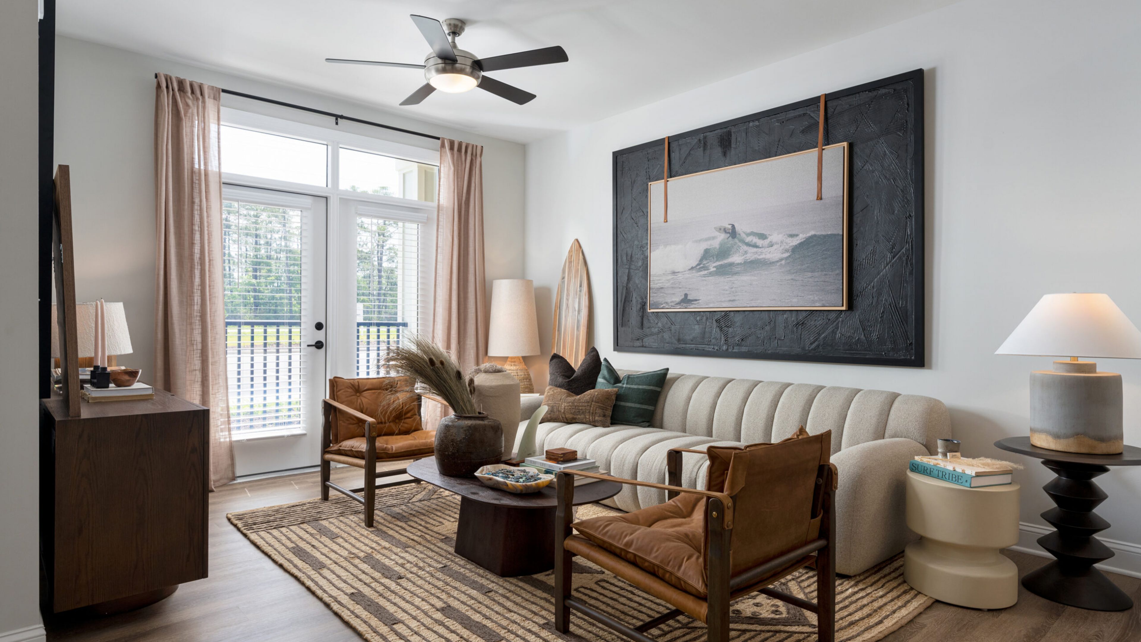 Hawthorne Ocean Isle apartment kitchen area with wrap around kitchen island, stainless steel appliances, and ample cabinet storage