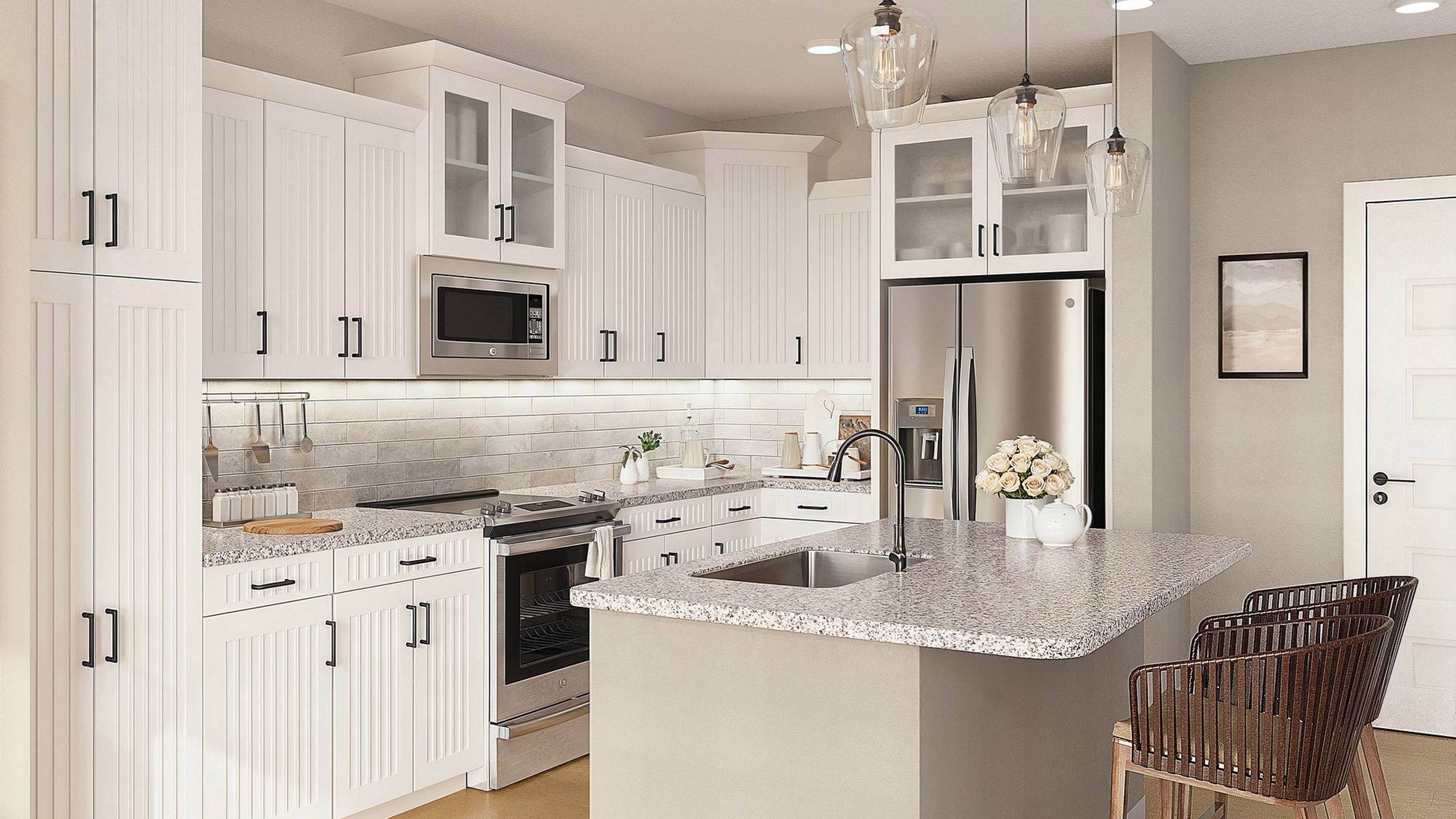 Hawthorne Ocean Isle apartment living space and kitchen with small dining table, kitchen peninsula, and stainless steel appliances